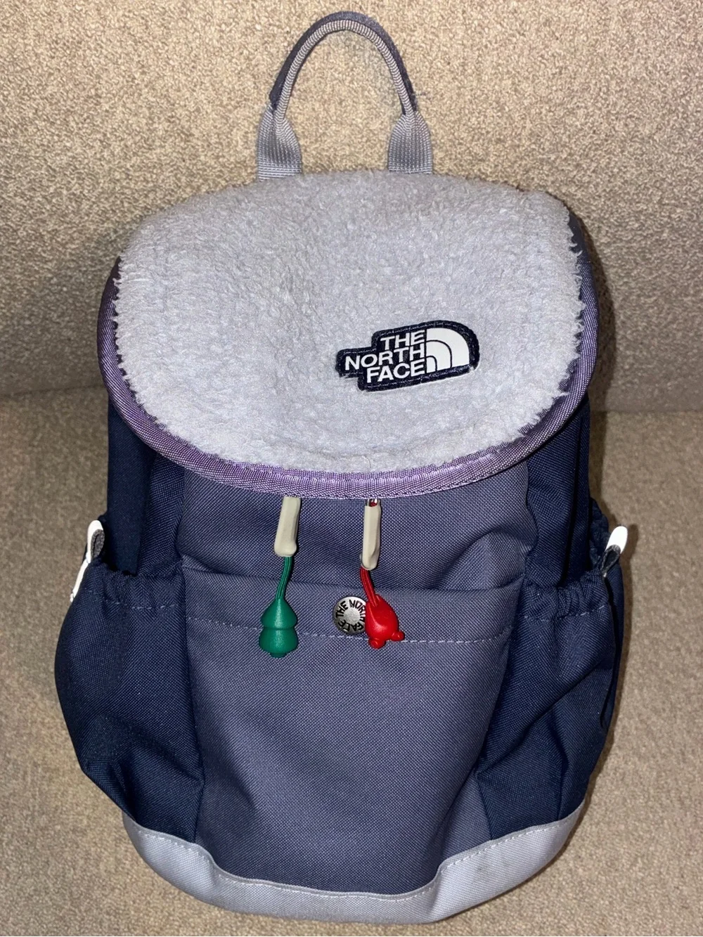 The North Face Kids Navy and Light Gray Backpack with Red & Green Pulls